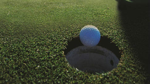 Golf ball on green